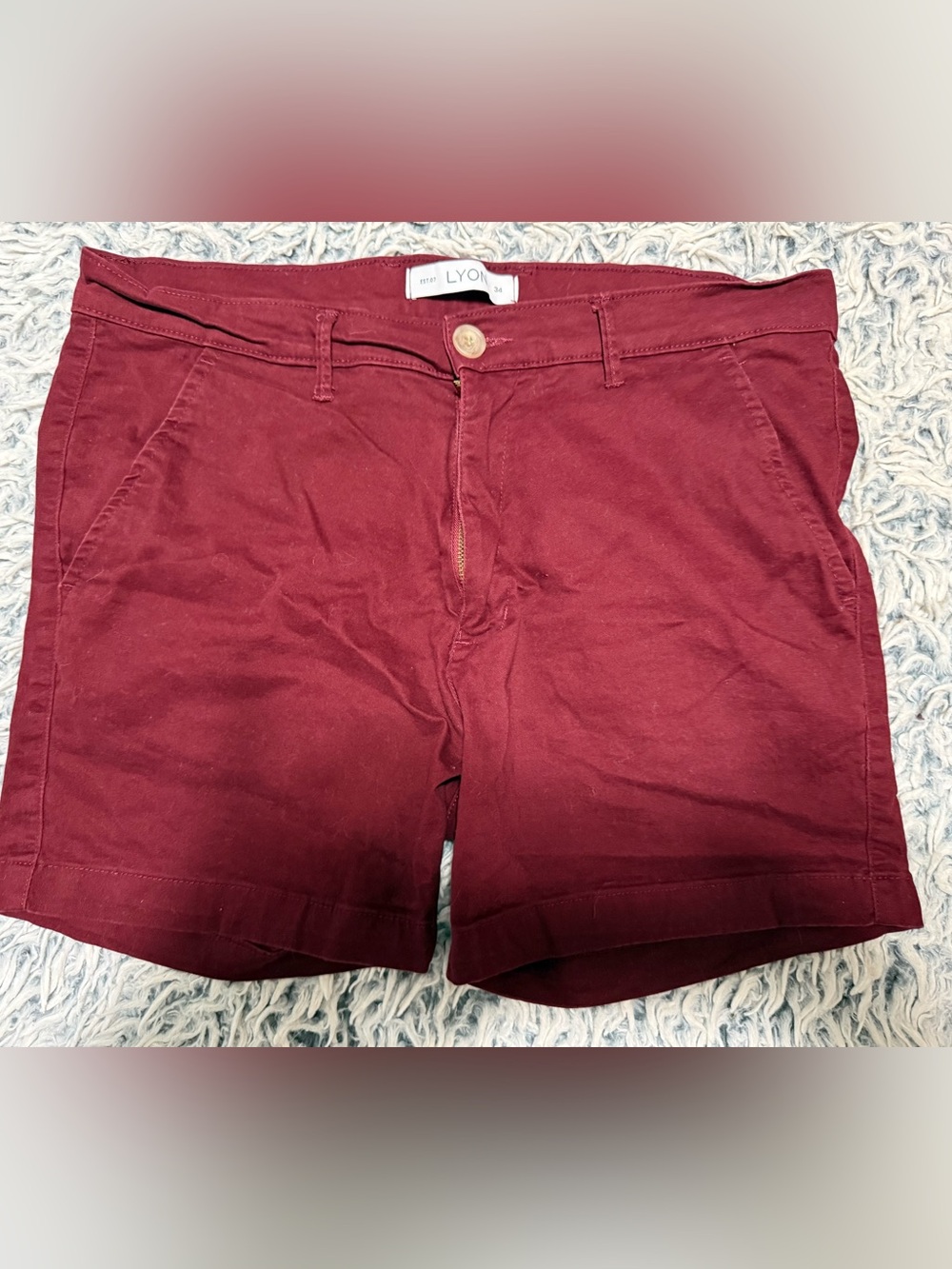 Men’s Lyon cotton with stretch shorts in burgundy. They are a size 34 waist.